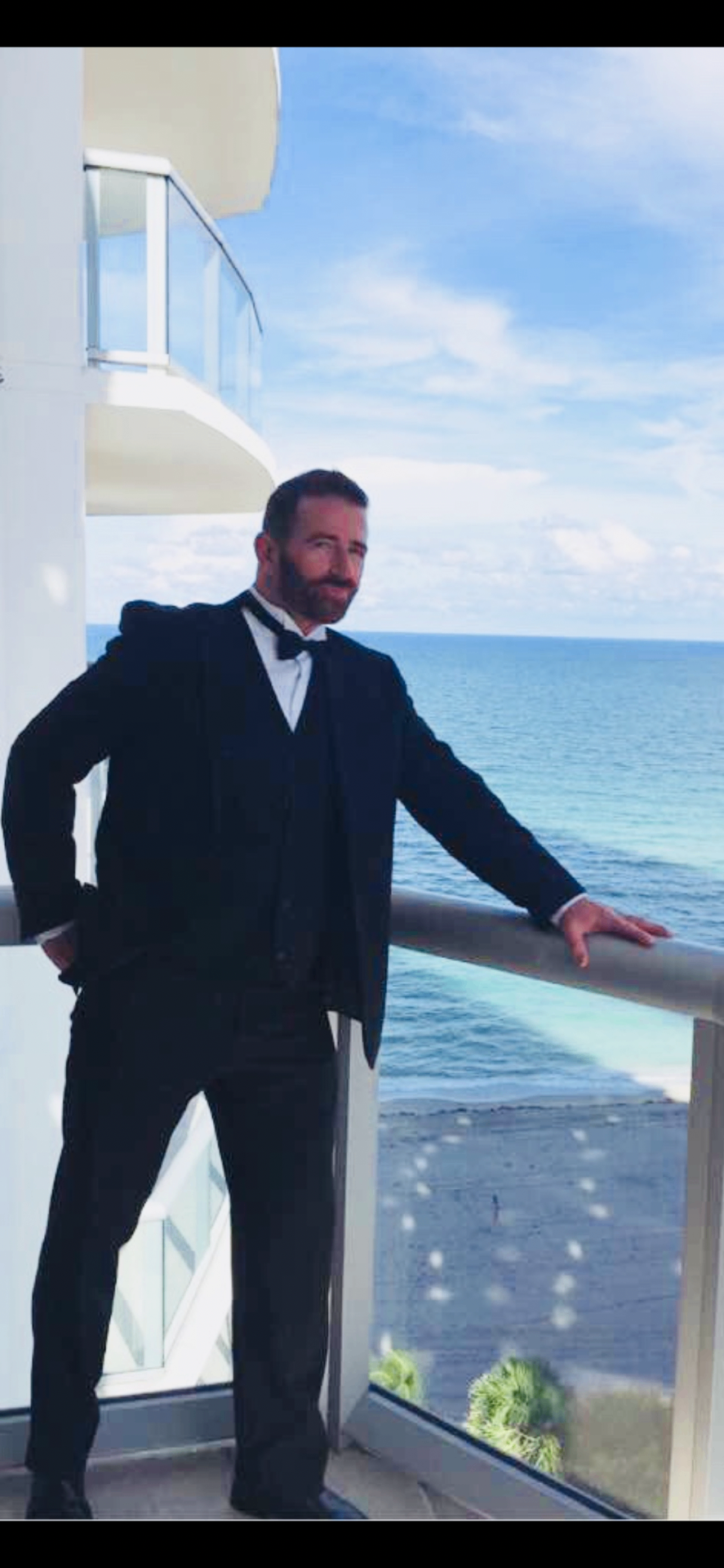 Johnny E, professional DJ and host, in a tuxedo